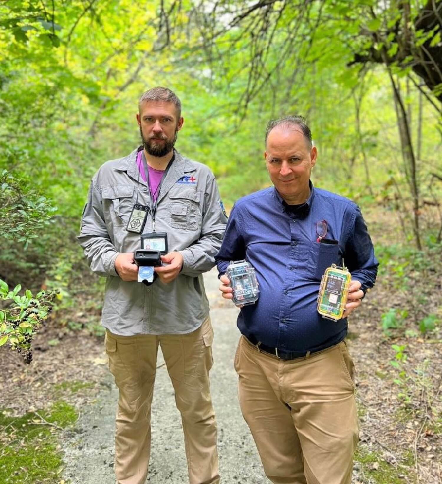 Chornobyl Wildlife Researcher Andrew Simon (left) and Safecast Lead Researcher Azby Brown (right) test Safecast devices in the Chornobyl's Pripyat City , September 2024 @Pavlo Tkachenko/Save Dnipro