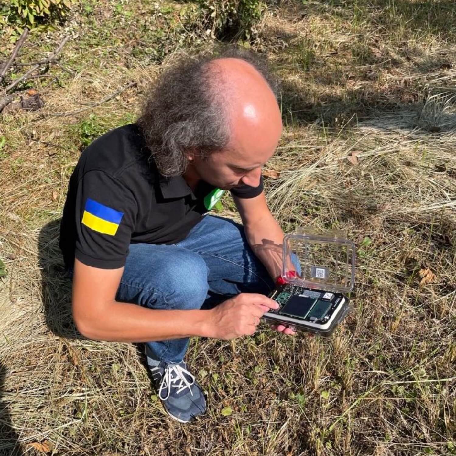SaveDnipro Technical Director Pavlo Tkachenko tests a Radnote inside the Chornobyl Exclusion Zone in September, 2023 @Azby Brown/Safecast
