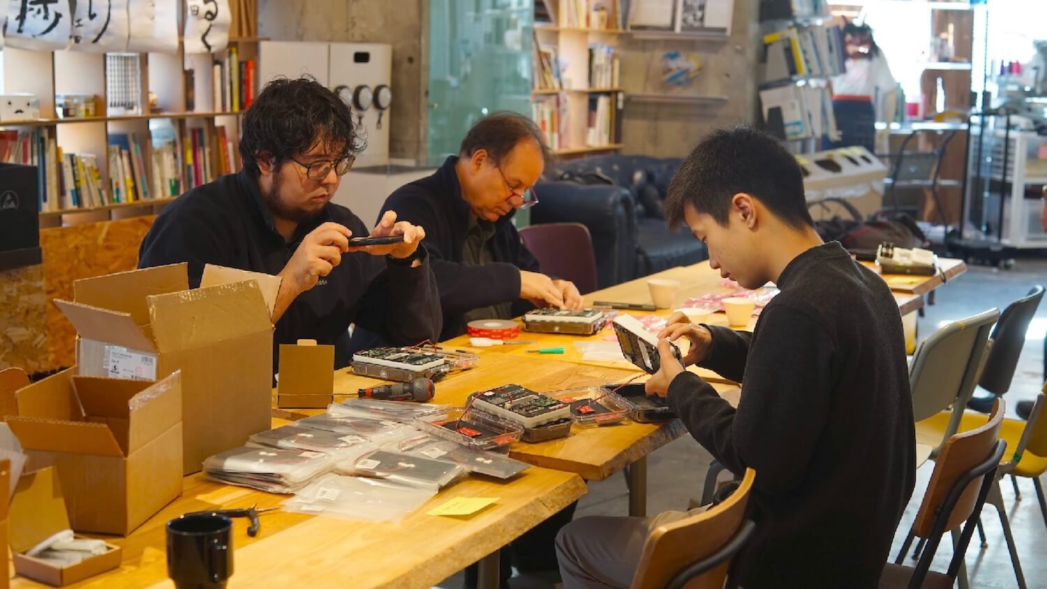 Safecast volunteers build Radnotes in Tokyo, January, 2024.