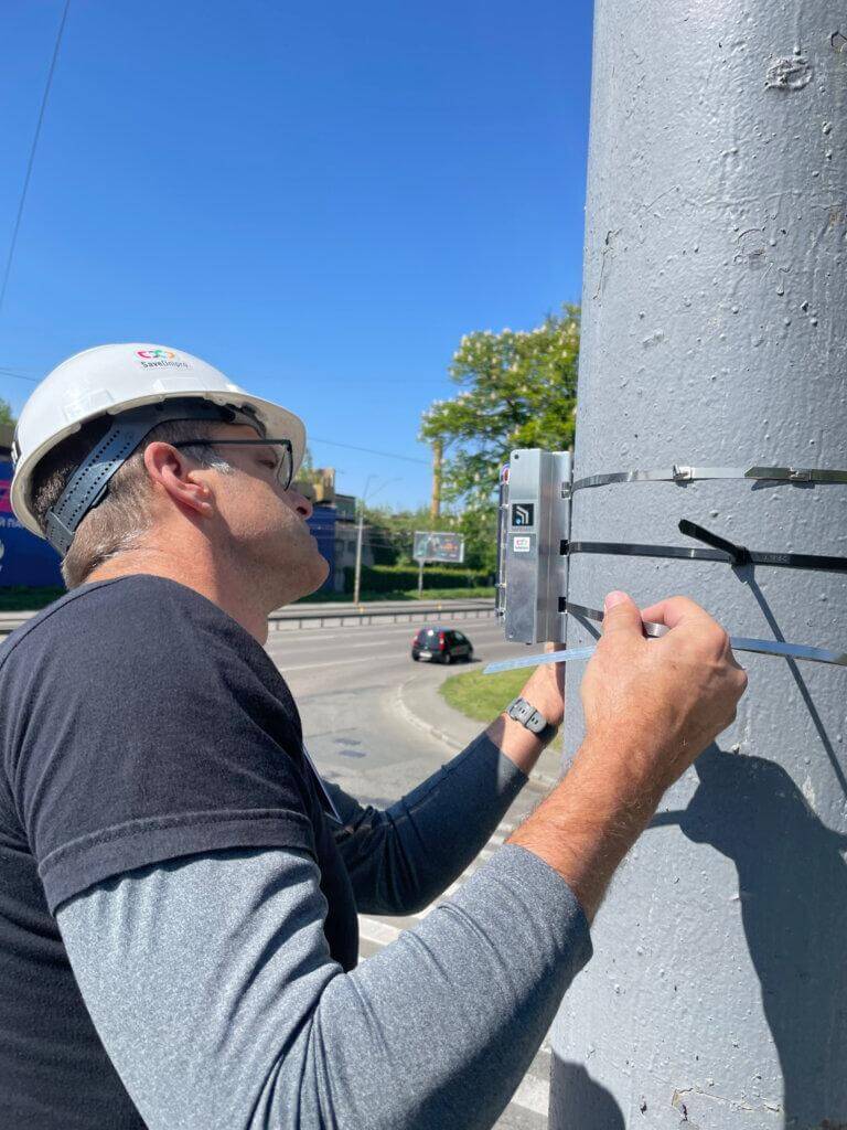 Safecast Lead Engineer Joe Moross installs a Radnote realtime radiation detector in Kyiv, Ukraine, May 9, 2024