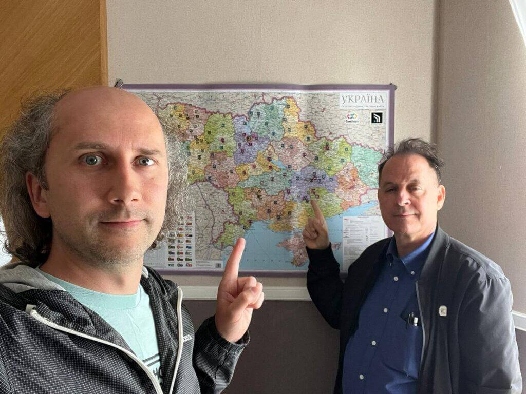 SaveDnipro Technical Director Pavlo Tkachenko (left) and Safecast Lead Researcher Azby Brown (right) discuss optimal deployment locations for Radnote realtime radiation detectors, Lviv, Ukraine, May 11, 2024