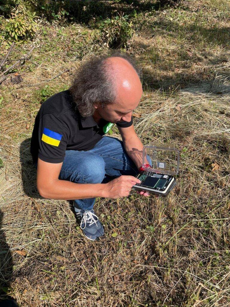 SaveDnipro Technical Director Pavlo Tkachenko tests a Radnote realtime radiation detector inside the Chornobyl Exclusion Zone, September, 2023