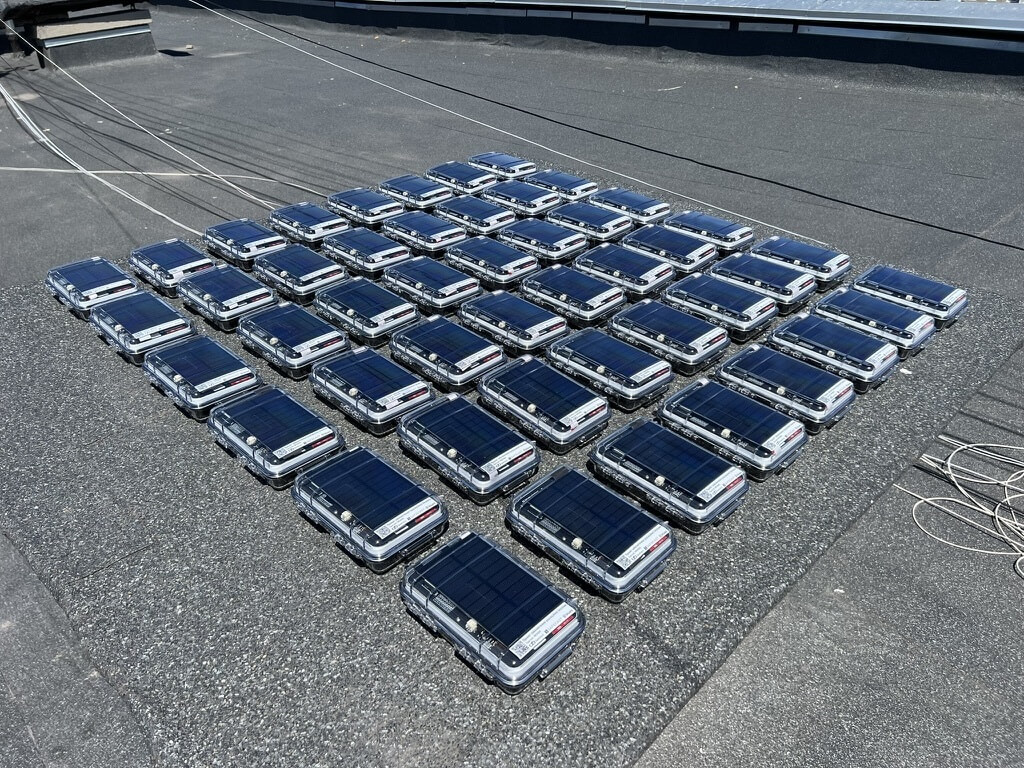 Forty-two Radnotes being charged on a sunny rooftop